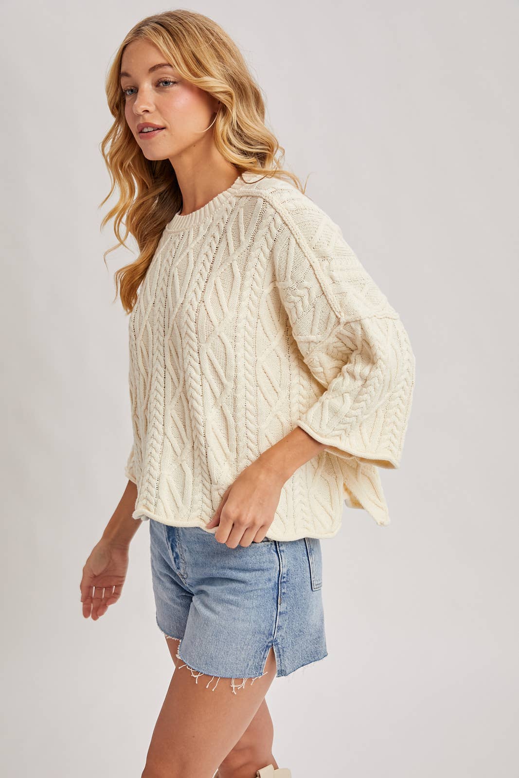 OVERSIZED BELL SLEEVE CABLE KNIT SWEATER