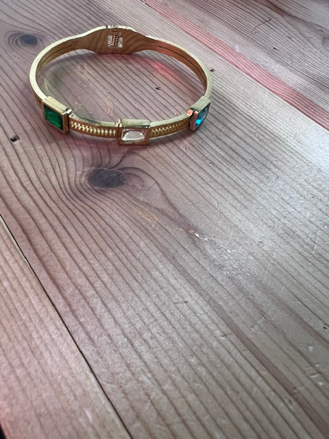 Gold bangle with color stones