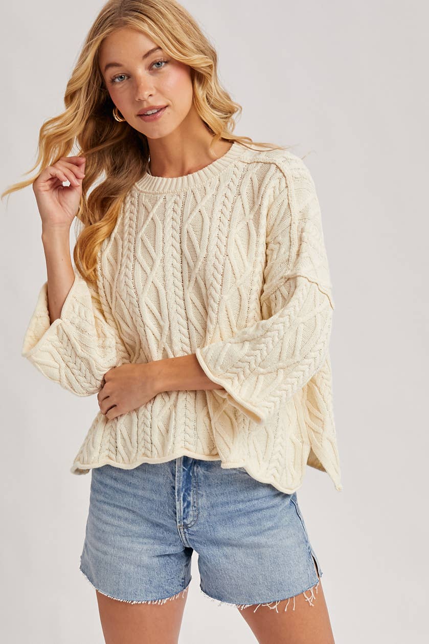 OVERSIZED BELL SLEEVE CABLE KNIT SWEATER